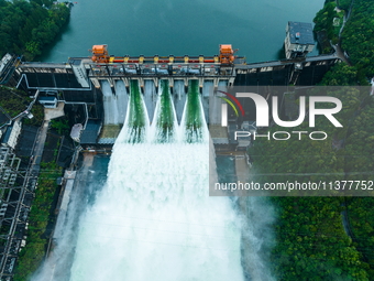 Flood discharge is happening from the Xin 'an River Dam in Hangzhou, China, on June 26, 2024. (