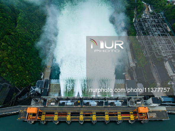 Flood discharge is happening from the Xin 'an River Dam in Hangzhou, China, on June 26, 2024. 