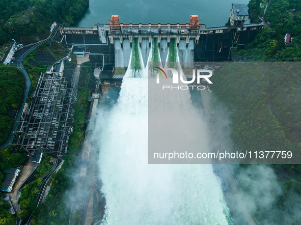 Flood discharge is happening from the Xin 'an River Dam in Hangzhou, China, on June 26, 2024. 