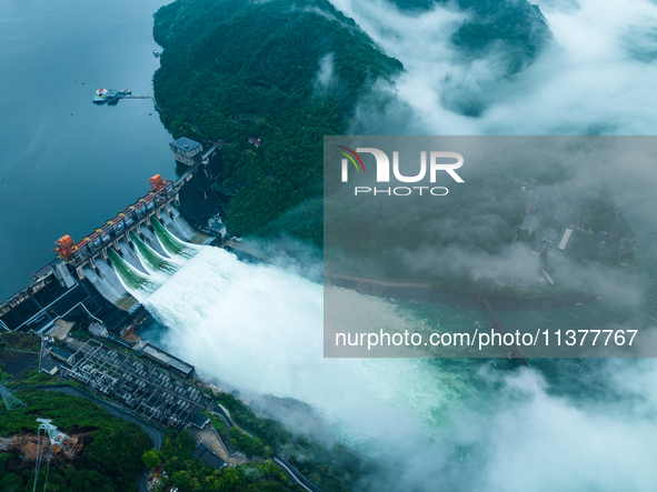 Flood discharge is happening from the Xin 'an River Dam in Hangzhou, China, on June 26, 2024. 