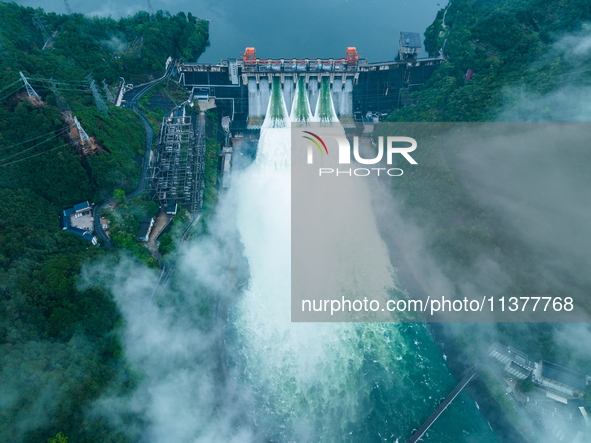 Flood discharge is happening from the Xin 'an River Dam in Hangzhou, China, on June 26, 2024. 