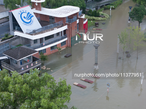 Water levels in the Nanjing section of the Yangtze River are rising above the warning line in Nanjing, Jiangsu province, China, on July 2, 2...