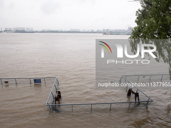 Water levels in the Nanjing section of the Yangtze River are rising above the warning line in Nanjing, Jiangsu province, China, on July 2, 2...