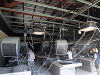 People are removing the debris from a supermarket damaged by a recent Russian missile attack in Dnipro, Ukraine, on July 1, 2024. Russia is...