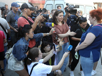 A woman affected by a recent Russian missile attack at a coordination headquarters is speaking to the press in Dnipro, Ukraine, on July 1, 2...