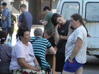 Locals are gathering at a coordination headquarters set up to help people affected by a recent Russian missile attack in Dnipro, Ukraine, on...