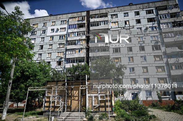 A damaged apartment block is being pictured in the rural settlement of Stepnohirsk, Ukraine, on June 28, 2024, that is being shelled daily b...