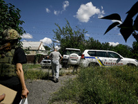 Volodymyr is walking towards a police car during the evacuation from the rural settlement of Stepnohirsk, which is shelled daily by Russian...