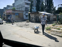 Locals are being pictured in the street in the rural settlement of Stepnohirsk that is being shelled daily by Russian troops as the team of...