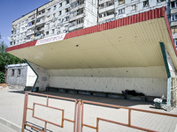 A local is lying on the bench inside a stop in the rural settlement of Stepnohirsk that is being shelled daily by Russian troops as the team...