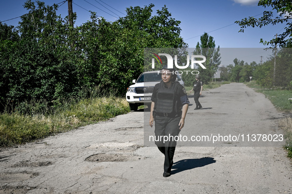 Police officers are on an evacuation mission in the rural settlement of Stepnohirsk that is being shelled daily by Russian troops in Zaporiz...