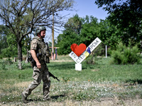 A community police officer is being seen in the street in the rural settlement of Stepnohirsk, Ukraine, on June 28, 2024, which is being she...