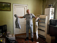 Volodymyr is standing in the room during the evacuation from the rural settlement of Stepnohirsk that is being shelled daily by Russian troo...