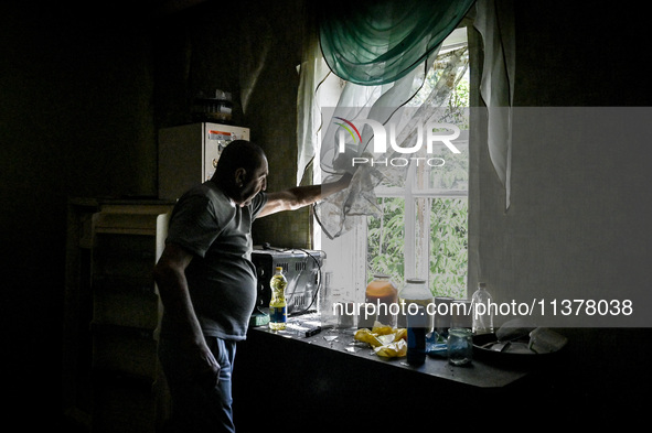 Volodymyr is looking out of the window during the evacuation from the rural settlement of Stepnohirsk, which is being shelled daily by Russi...