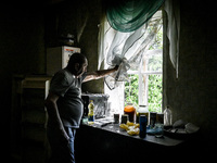 Volodymyr is looking out of the window during the evacuation from the rural settlement of Stepnohirsk, which is being shelled daily by Russi...