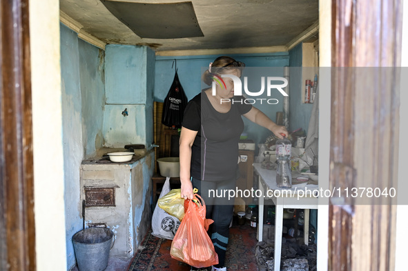 Iryna is leaving her place during the evacuation from the rural settlement of Stepnohirsk, which is being shelled daily by Russian troops, i...