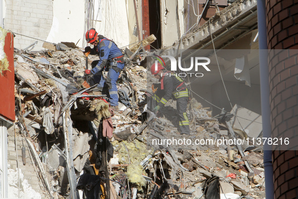 Rescuers are removing the rubble at the apartment block hit by a Russian missile in Dnipro, Ukraine, on June 30, 2024. NO USE RUSSIA. NO USE...