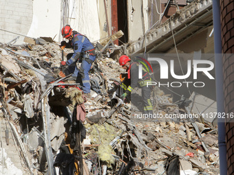 Rescuers are removing the rubble at the apartment block hit by a Russian missile in Dnipro, Ukraine, on June 30, 2024. NO USE RUSSIA. NO USE...