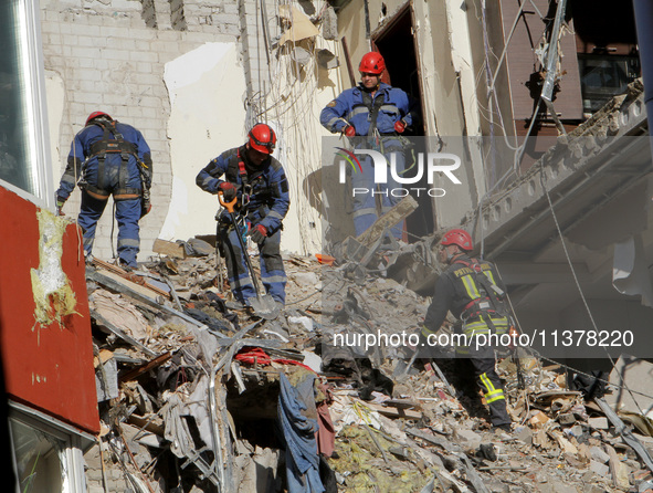 Rescuers are removing the rubble at the apartment block hit by a Russian missile in Dnipro, Ukraine, on June 30, 2024. NO USE RUSSIA. NO USE...