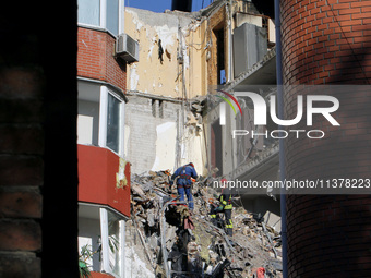 Rescuers are removing the rubble at the apartment block hit by a Russian missile in Dnipro, Ukraine, on June 30, 2024. NO USE RUSSIA. NO USE...