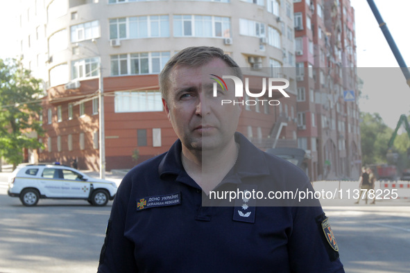 Deputy head of the State Emergency Service in Dnipropetrovsk region Serhii Korinnyi is being pictured during a response effort at the apartm...