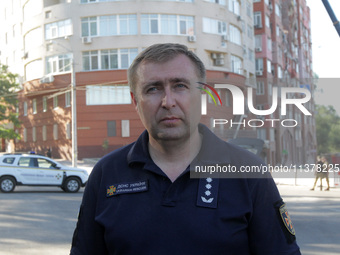 Deputy head of the State Emergency Service in Dnipropetrovsk region Serhii Korinnyi is being pictured during a response effort at the apartm...