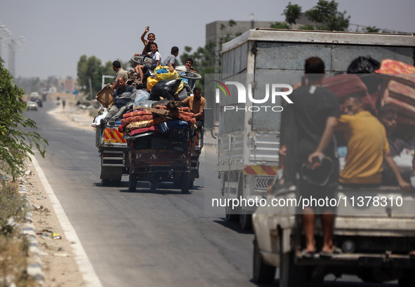 Displaced Palestinians are leaving an area in east Khan Yunis after the Israeli army issues a new evacuation order for parts of the city and...