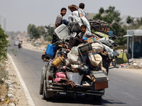 Displaced Palestinians are leaving an area in east Khan Yunis after the Israeli army issues a new evacuation order for parts of the city and...