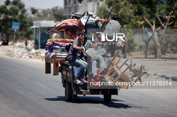 Displaced Palestinians are leaving an area in east Khan Yunis after the Israeli army issues a new evacuation order for parts of the city and...