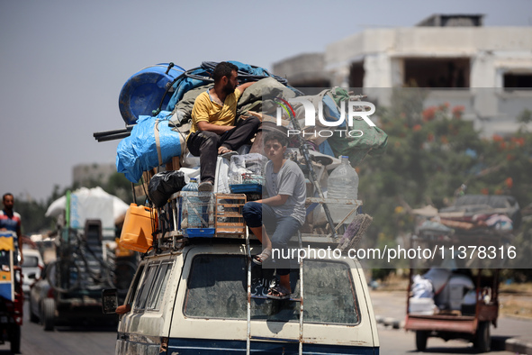 Displaced Palestinians are leaving an area in east Khan Yunis after the Israeli army issues a new evacuation order for parts of the city and...