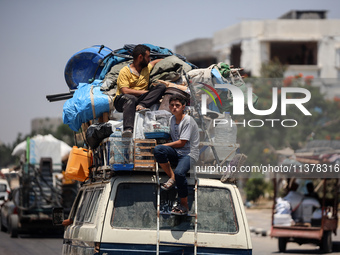 Displaced Palestinians are leaving an area in east Khan Yunis after the Israeli army issues a new evacuation order for parts of the city and...