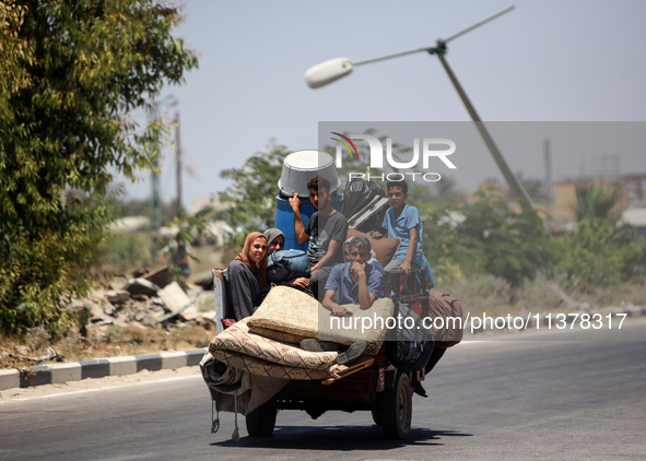 Displaced Palestinians are leaving an area in east Khan Yunis after the Israeli army issues a new evacuation order for parts of the city and...