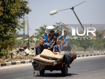 Displaced Palestinians are leaving an area in east Khan Yunis after the Israeli army issues a new evacuation order for parts of the city and...