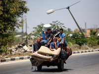 Displaced Palestinians are leaving an area in east Khan Yunis after the Israeli army issues a new evacuation order for parts of the city and...