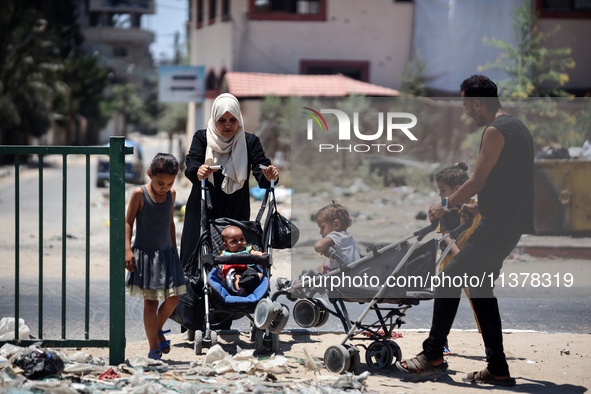 Displaced Palestinians are leaving an area in east Khan Yunis after the Israeli army issues a new evacuation order for parts of the city and...