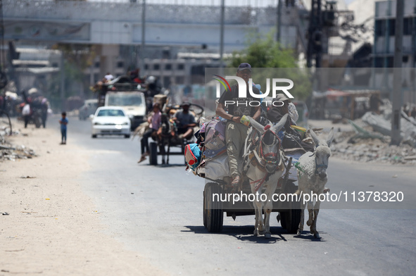 Displaced Palestinians are leaving an area in east Khan Yunis after the Israeli army issues a new evacuation order for parts of the city and...