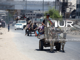 Displaced Palestinians are leaving an area in east Khan Yunis after the Israeli army issues a new evacuation order for parts of the city and...