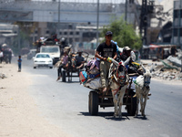 Displaced Palestinians are leaving an area in east Khan Yunis after the Israeli army issues a new evacuation order for parts of the city and...