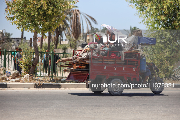 Displaced Palestinians are leaving an area in east Khan Yunis after the Israeli army issues a new evacuation order for parts of the city and...