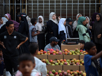 Displaced Palestinian women are queuing for bread in Deir el-Balah in the central Gaza Strip on July 2, 2024, amid the ongoing conflict in t...