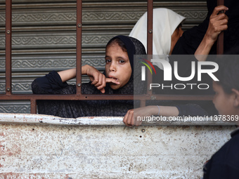 Displaced Palestinian women are queuing for bread in Deir el-Balah in the central Gaza Strip on July 2, 2024, amid the ongoing conflict in t...