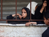 Displaced Palestinian women are queuing for bread in Deir el-Balah in the central Gaza Strip on July 2, 2024, amid the ongoing conflict in t...