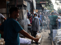 Displaced Palestinian women are queuing for bread in Deir el-Balah in the central Gaza Strip on July 2, 2024, amid the ongoing conflict in t...