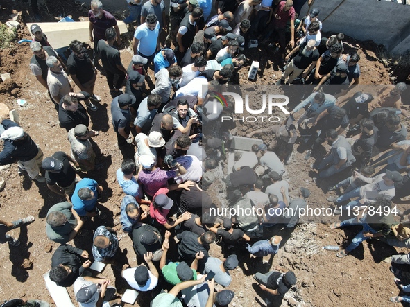 Syrians participated in the funeral of a man killed during clashes with Turkish forces in Afrin, northern Syria, on July 2, 2024. Four peopl...