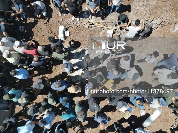 Syrians participated in the funeral of a man killed during clashes with Turkish forces in Afrin, northern Syria, on July 2, 2024. Four peopl...