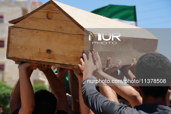 Syrians participated in the funeral of a man killed during clashes with Turkish forces in Afrin, northern Syria, on July 2, 2024. Four peopl...