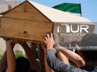 Syrians participated in the funeral of a man killed during clashes with Turkish forces in Afrin, northern Syria, on July 2, 2024. Four peopl...