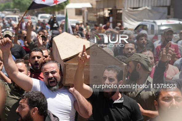 Syrians participated in the funeral of a man killed during clashes with Turkish forces in Afrin, northern Syria, on July 2, 2024. Four peopl...