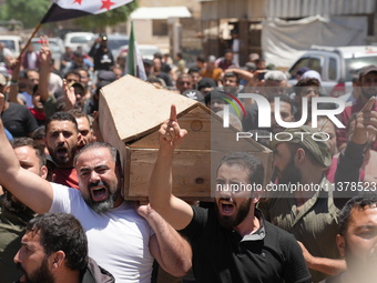 Syrians participated in the funeral of a man killed during clashes with Turkish forces in Afrin, northern Syria, on July 2, 2024. Four peopl...