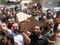 Syrians participated in the funeral of a man killed during clashes with Turkish forces in Afrin, northern Syria, on July 2, 2024. Four peopl...